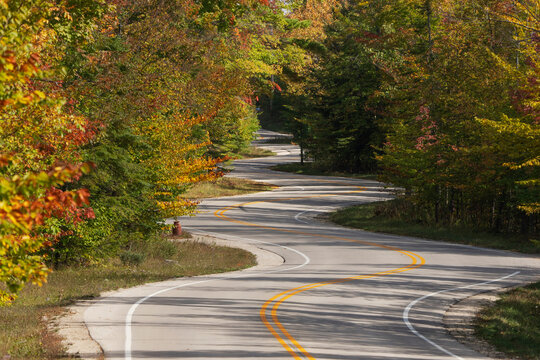 USA, Wisconsin. Curvy road in Door County in autumn.