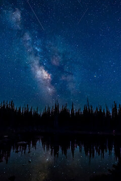 Wyoming, Medicine Bow National Forest. Milky Way and shooting stars from Perseids meteor shower.