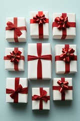 Nine elegant gift boxes arranged in a grid, adorned with red ribbons and bows