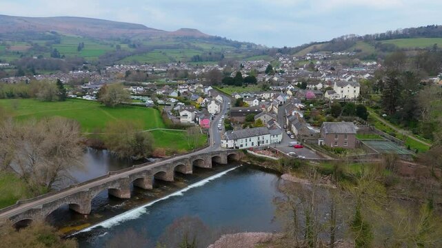 Crickhowell Wales 4K Aerial Video of Bridge River Usk Town Streets and Brecon Beacons Hills