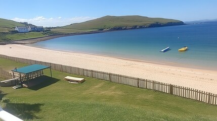 Picturesque beach with grassy area and a gazebo