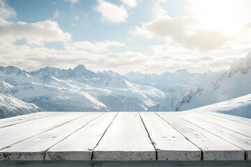 Empty white wooden floor or table podium. Mountain surrounded by snow landscape is background. Blue sky with white clouds, bright sunlight. Abstract Texture. Advertising podium display.