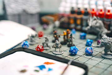 Role playing tabletop game miniatures adventure in dungeon story TTRPG on gamer crafting table