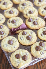 Mini chocolate chip cookies in a clear plastic container