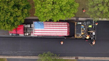Roadwork development new asphalt road and real estate houses at Suburban. Aerial top down shot with usa national flag on it