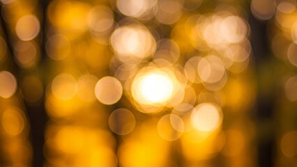 Obraz premium Golden Bokeh Dreamscape: A Soft and Ethereal Abstract of Blurred Golden and Yellow Lights Creating a Warm, Dreamy, and Out-of-Focus Background Texture.