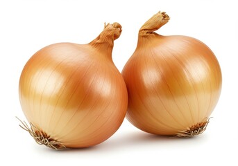 Two golden onions sitting side by side on a white surface in a studio setting with natural lighting