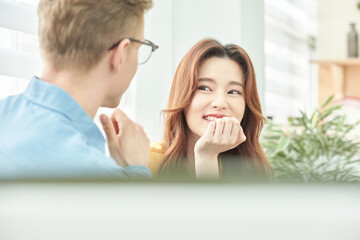 Smiling Woman and Man in Bright Office Conversation