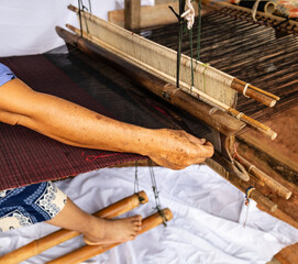Traditional loom machine vintage style is tool for weave of making silk from cocoon use by homemade in Laos and Thailand