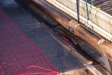 Traditional loom machine vintage style is tool for weave of making silk from cocoon use by homemade...