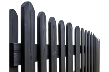 a close-up view of a black wooden fence with pointed tops emphasizing its structure and design. texture and uniformity of the fence suitable for various outdoor settings
