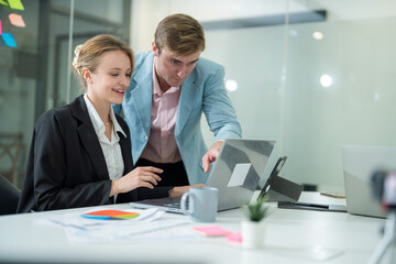 Colleagues collaborating on a project in a modern office setting during the day