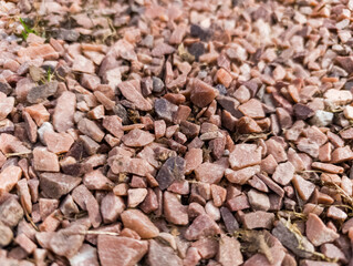 A close up of a pile of small rocks on the ground