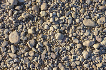 the structure of the rocky bottom of a dried-up riverbed in the autumn period of the year