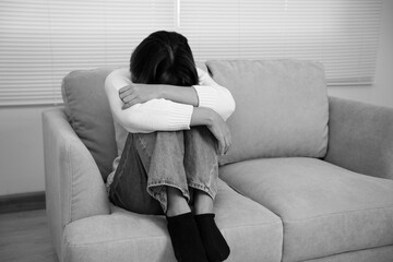 Monochrome picture, Depression and mental illness. Asian woman disappointed, sad after receiving...
