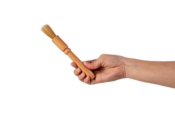 Hand using a little paintbrush isolated on a transparent background