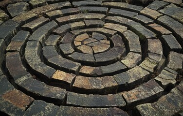 Stone Circle Spiral: A Concentric Pattern of Rustic Stones