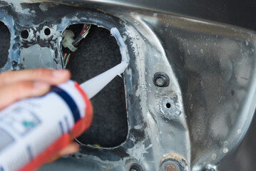 silicone sealant to Tail lamp body path of car 