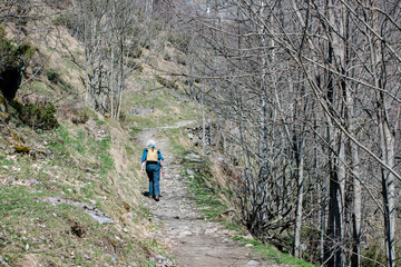 Mature or retired woman hiking in the magnificent landscapes of the Cirque de Gavarnie, in the Pyrenees