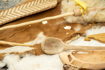 traditional objects made of wood on the table of an artisan at a historical festival in galicia