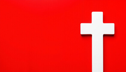 Fototapeta premium White cross on red background symbolizing faith and spirituality 