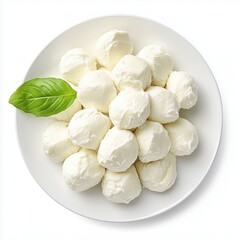 Small mozzarella balls on a plate with basil leaves, top view, white background.