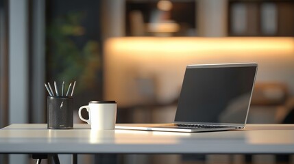 Minimalist office desk with laptop and coffee cup in modern blurred interior, close-up digital workspace concept for business productivity, remote work, or branding