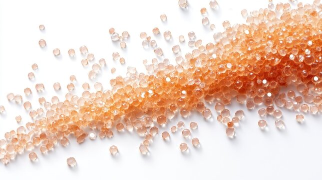 Scattered brown silica gel beads on white surface for moisture absorption