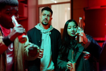 Friends enjoying drinks together in an urban setting during a vibrant evening gathering