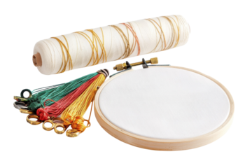 Artistic embroidery tools arranged creatively, showcasing vibrant threads and a wooden hoop isolated on transparent background
