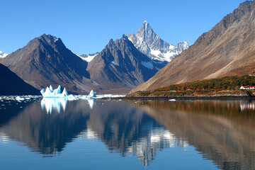 Polar landscape showcases chaotic ice formations near the Arctic coast during twilight hours