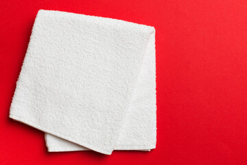 Top view of white towels with copy space on colored background