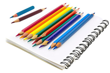 A vibrant assortment of colored pencils arranged on a blank sketchbook ready for creativity isolated on transparent background