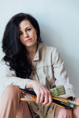 artist holding brushes in her hands to paint paintings