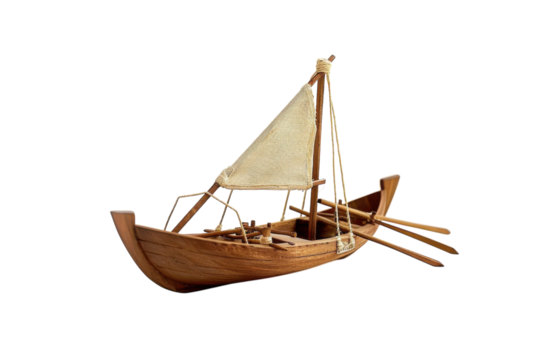 A handcrafted wooden sailboat model with intricate details on a white background isolated on transparent background