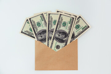 An envelope with dollars on an isolated white background