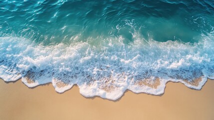 Obraz premium Beach waves gently lap the golden sand under sunlight