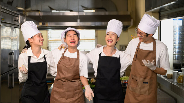Group of culinary students laughing and enjoying their training experience