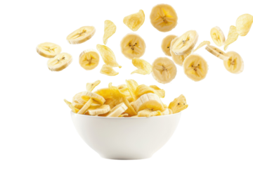 Fresh banana slices gracefully leap from a bowl, capturing the essence of a vibrant kitchen moment isolated on transparent background
