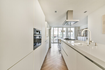 A sleek and contemporary kitchen featuring clean lines, an open layout, and neutral colors that create a spacious and inviting atmosphere.