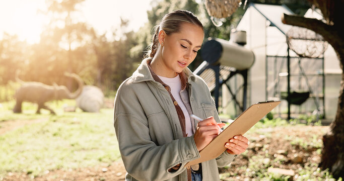Writing, research and clipboard with woman in nature for zoologist, wildlife conservation and sustainability tracking. Endangered species study, habitat project and environment with person outdoor