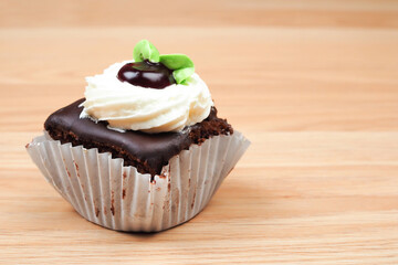 Coffee flavored bakery on wooden background