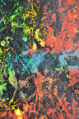 Thick abstract paint surface with heavy texture looking a bit like graffiti hand drawn real dark background