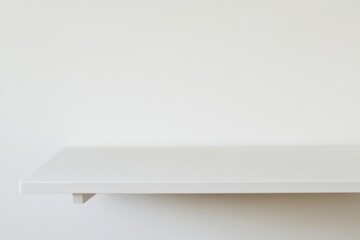 Minimalist white shelf against textured white wall clean simple aesthetic perfect for product display or mockups studio shot with bright neutral backdrop