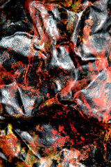 Thick abstract paint surface with heavy texture looking a bit like graffiti hand drawn real dark background