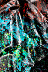 Thick abstract paint surface with heavy texture looking a bit like graffiti hand drawn real dark background