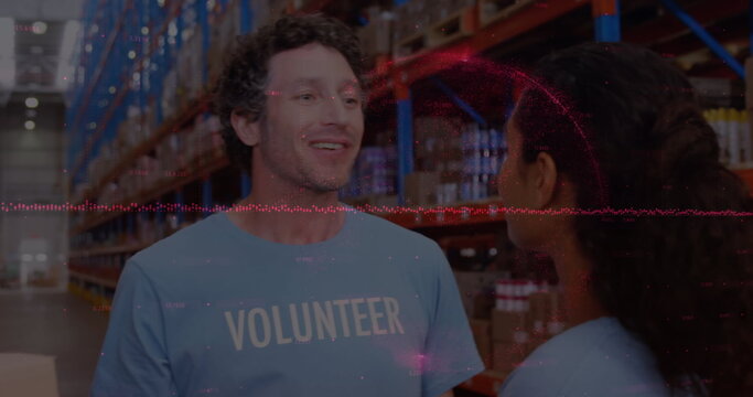 Image of financial data processing over diverse volunteers in warehouse