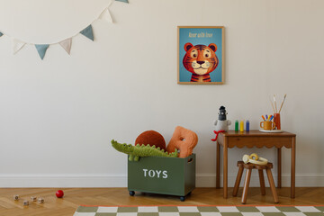 Sunny corner of a kids' room with toys in a green box, a cheerful tiger poster, and a creative workspace set against a white wall.