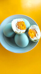 Salted egg served on toast and white plate