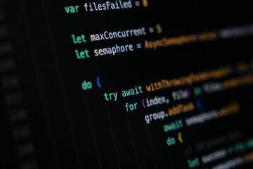 Close-up of Swift programming code showing asynchronous task handling and concurrency logic